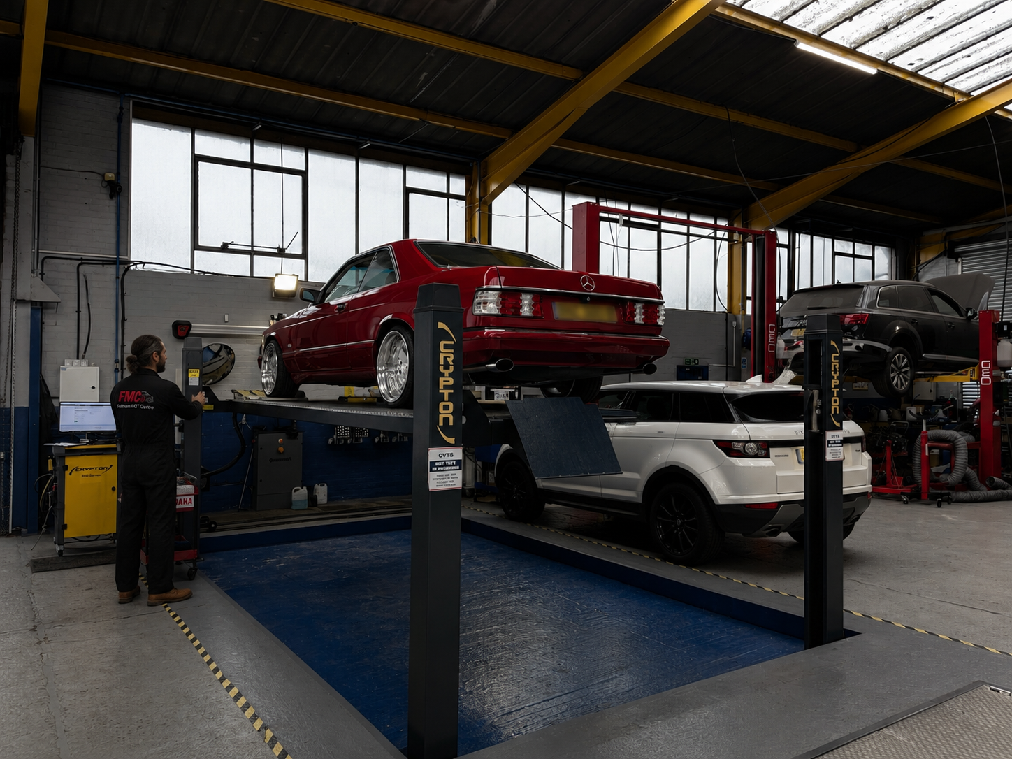 A Feltham MOT Centre technician running diagnostics on a vehicle
